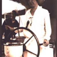 Lady at wheel of United States Coast Guard Cutter Pamlico